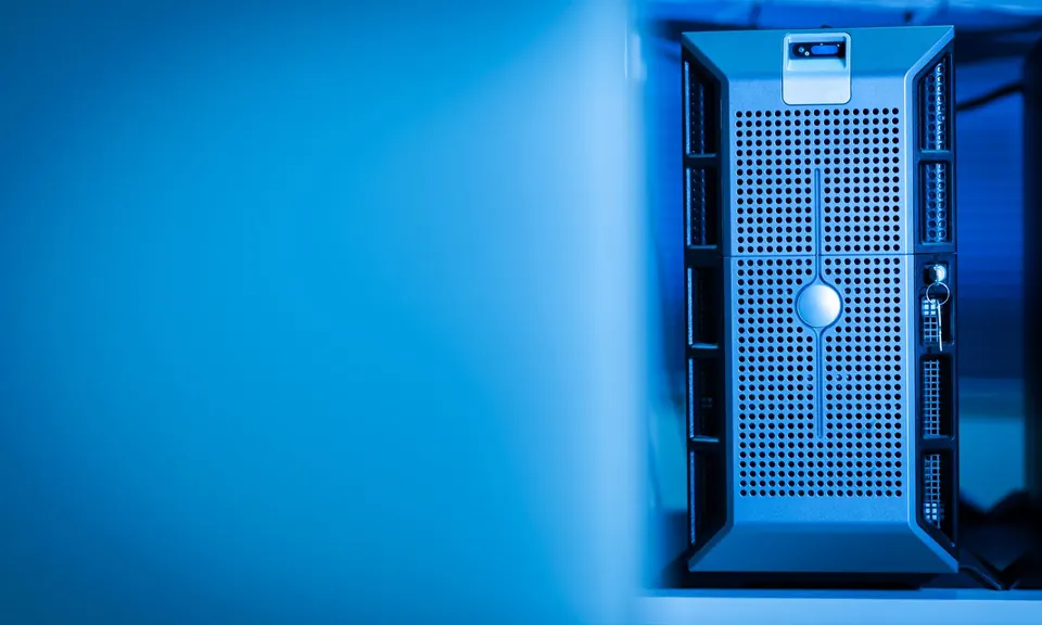 Server unit lit in blue inside a data centre
