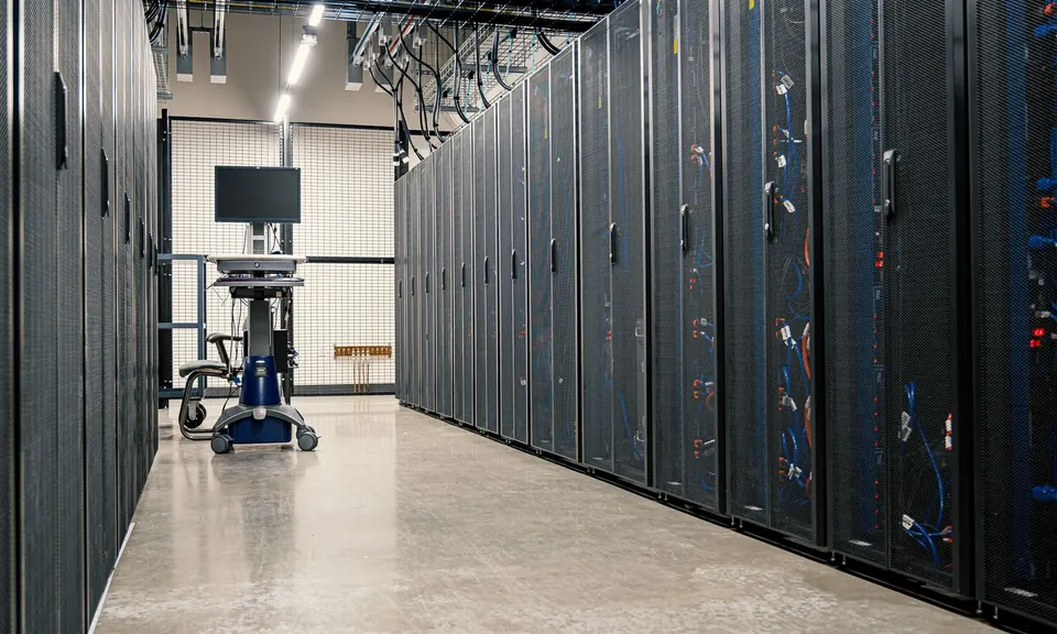 Aisle between rows of server racks in a data centre
